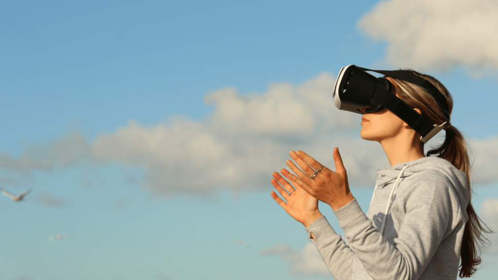 woman using vr against sky background