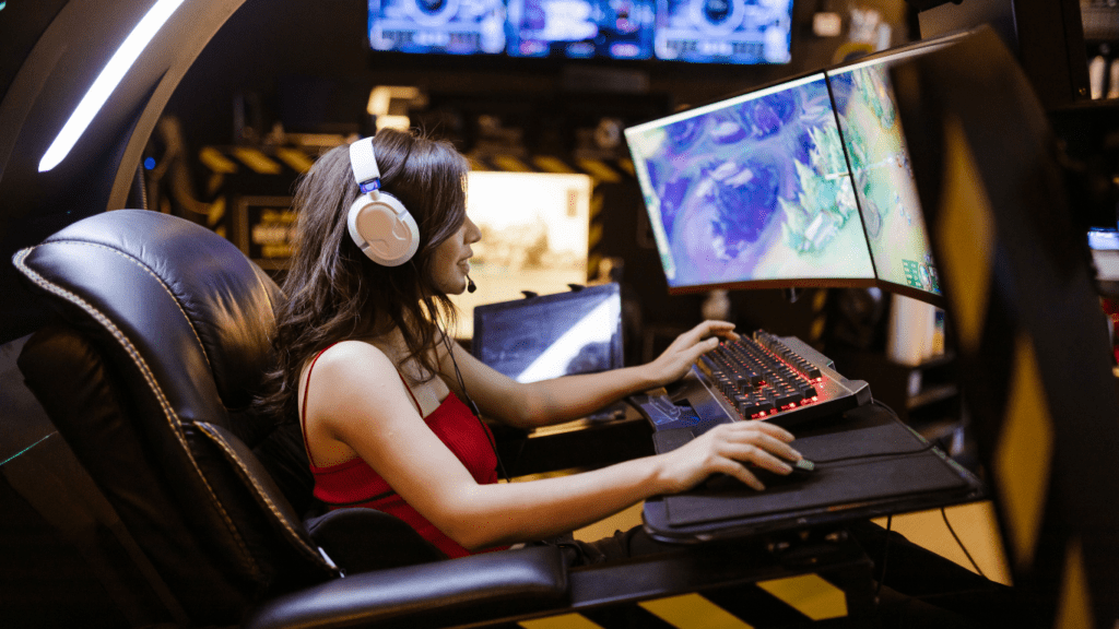 woman playing games in a multi monitor setup