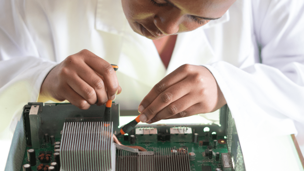 technician fixing graphics card