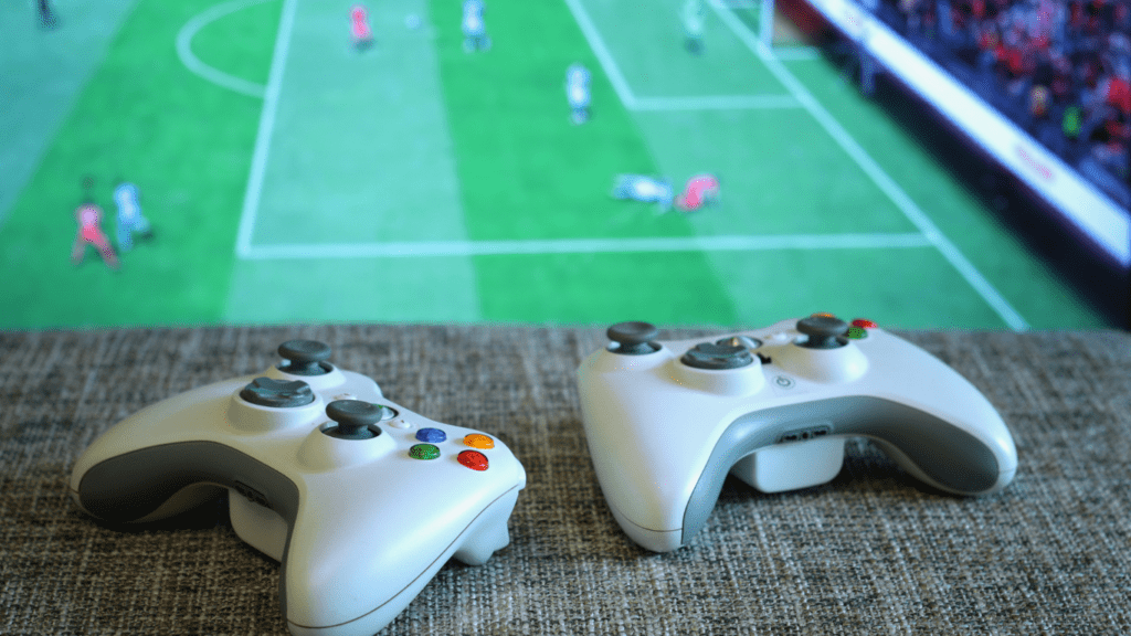 two controllers with soccer game