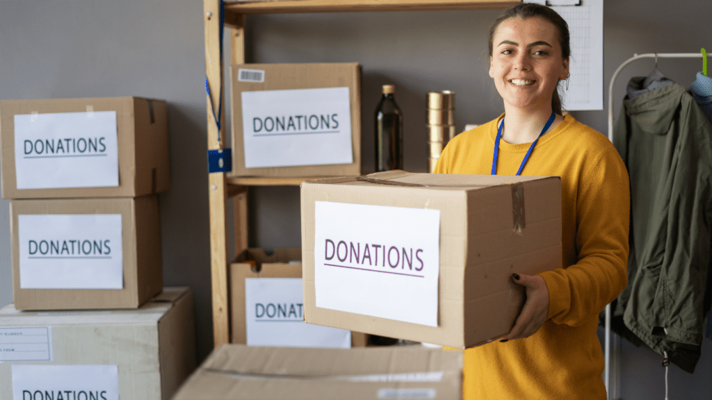 woman holding box of donations